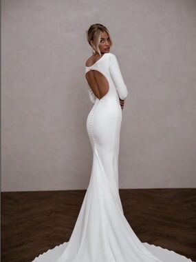 Backless White Long-Sleeve Bridal Gown with Button Detail